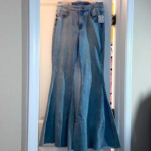 CRVY Super High-Rise Lace-Up Flare Jeans